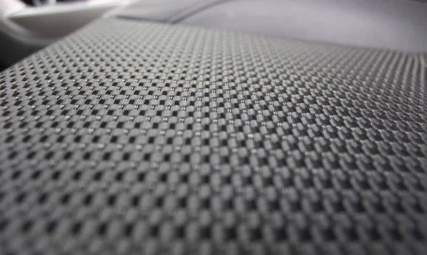 Detalle de tapizado de tela automotriz tratado con recubrimiento hidrofóbico SecondSkin